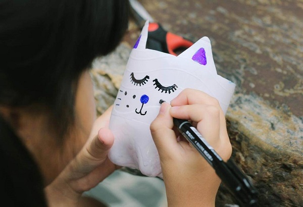 Cute Little Girl Colored Her DIY Water Bottles.