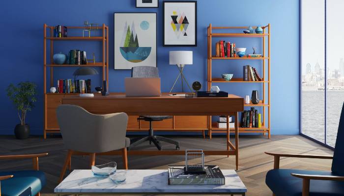 An Image Represents home office interior design in blue shade with laptop, Table & Chairs